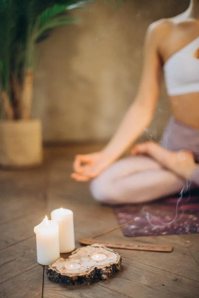 Person meditating in peaceful nature setting symbolizes relaxation, mindfulness, inner peace.