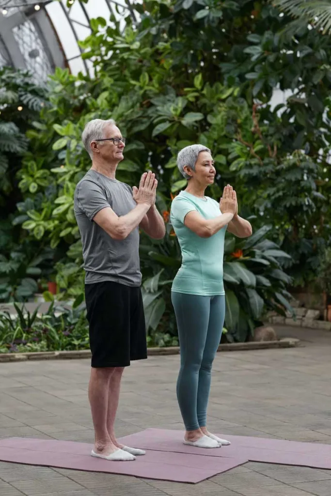Meditation blog image: Elderly individuals in serene natural setting, inviting exploration of mindfulness benefits across all ages.