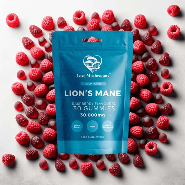 lions mane pouch gummies on top of raspberries and gummies